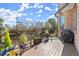 A spacious back deck with a gas grill and views of the surrounding greenery at 2046 Chambord Way, Snellville, GA 30078