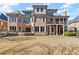 Large backyard and exterior view of home with a stone patio at 2046 Chambord Way, Snellville, GA 30078