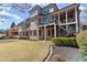 Expansive backyard featuring a multi-level deck, lush lawn, and meticulously landscaped grounds at 2046 Chambord Way, Snellville, GA 30078