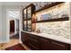 Sophisticated bar area featuring custom cabinetry and elegant finishes at 2046 Chambord Way, Snellville, GA 30078
