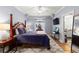 Bedroom with a four-poster bed, a ceiling fan and access to the ensuite bathroom at 2046 Chambord Way, Snellville, GA 30078
