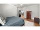 Bedroom featuring hardwood floors, ceiling fan, ensuite bathroom, and a comfortable bed at 2046 Chambord Way, Snellville, GA 30078