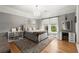 This cozy bedroom features a decorative chandelier, a vanity area, and an area rug over the hardwood floor at 2046 Chambord Way, Snellville, GA 30078