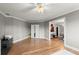 Bright bonus room featuring hardwood floors, white trim, a doorway, and a view to another room at 2046 Chambord Way, Snellville, GA 30078