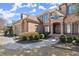 Charming brick home with elegant landscaping and inviting entrance, showcasing curb appeal at 2046 Chambord Way, Snellville, GA 30078