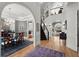 Spacious foyer with hardwood floors, open staircase, and views into the dining and living areas at 2046 Chambord Way, Snellville, GA 30078