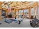 Unfinished workout space featuring exposed ceiling and lots of natural light at 2046 Chambord Way, Snellville, GA 30078