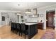 Kitchen with a large center island, stainless steel appliances, and modern light fixtures at 2046 Chambord Way, Snellville, GA 30078