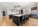 Well-lit kitchen featuring a large island with seating and stainless steel appliances at 2046 Chambord Way, Snellville, GA 30078