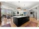 Open kitchen with a large center island and modern appliances, blending seamlessly into the living spaces at 2046 Chambord Way, Snellville, GA 30078