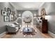 Cozy living room featuring hardwood floors, neutral paint, and a decorative mirror at 2046 Chambord Way, Snellville, GA 30078