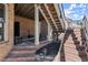 Covered patio and stairway providing access to the backyard and upper levels at 2046 Chambord Way, Snellville, GA 30078