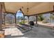 Outdoor pavilion featuring a picnic table, grill, and scenic view of the pond and fountain at 2046 Chambord Way, Snellville, GA 30078