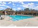 Community pool featuring lounge chairs, umbrellas, and a spacious deck for residents at 2046 Chambord Way, Snellville, GA 30078