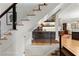 Beautiful staircase with modern railings next to a bar, leading to other living spaces at 2046 Chambord Way, Snellville, GA 30078