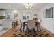 Elegant dining room with hardwood floors, a round table, and a modern chandelier at 6 Walnut Hill Nw Pl, Atlanta, GA 30318