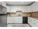 Well-lit kitchen featuring white cabinets, stainless steel appliances, and granite countertops at 6 Walnut Hill Nw Pl, Atlanta, GA 30318