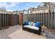 Relaxing outdoor patio with comfortable seating and a privacy fence at 6 Walnut Hill Nw Pl, Atlanta, GA 30318
