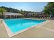 Large community pool with lounge chairs and a covered area for relaxing by the pool at 6 Walnut Hill Nw Pl, Atlanta, GA 30318