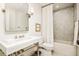 Bright bathroom featuring marble tile, stone floors, and a marble vanity at 2575 Peachtree Ne Rd # 8D, Atlanta, GA 30305