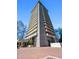 Exterior of the building featuring a modern design with concrete materials and a covered entrance at 2575 Peachtree Ne Rd # 8D, Atlanta, GA 30305