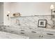 Bright kitchen showcases white marble countertops, backsplash, and hardware at 2575 Peachtree Ne Rd # 8D, Atlanta, GA 30305