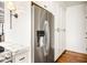 Kitchen features stainless steel refrigerator and white cabinets at 2575 Peachtree Ne Rd # 8D, Atlanta, GA 30305