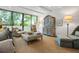 Comfortable living room featuring stylish furniture, large windows, and a serene atmosphere at 2575 Peachtree Ne Rd # 8D, Atlanta, GA 30305