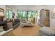 Bright living room with a large window, offering an inviting space with ample seating and natural light at 2575 Peachtree Ne Rd # 8D, Atlanta, GA 30305