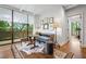 Relaxing area with table, seating, and an expansive window, creating a peaceful retreat at 2575 Peachtree Ne Rd # 8D, Atlanta, GA 30305