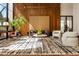 Lobby area featuring decorative carpet, accent furniture, and floor to ceiling windows at 2575 Peachtree Ne Rd # 8D, Atlanta, GA 30305