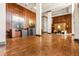Open lobby area with wood panel walls, decorative tables, neutral color palette, and brick floors at 2575 Peachtree Ne Rd # 8D, Atlanta, GA 30305