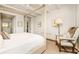 Bright main bedroom features a four poster bed with stylish decor at 2575 Peachtree Ne Rd # 8D, Atlanta, GA 30305