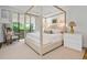 Bright main bedroom with a four poster bed and elegant furniture at 2575 Peachtree Ne Rd # 8D, Atlanta, GA 30305