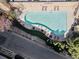 Aerial view of a sparkling community pool with ample lounge seating, surrounded by lush landscaping at 3481 Lakeside Ne Dr # 2303, Atlanta, GA 30326