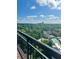 Enjoy city views from this balcony, showcasing a community pool and lush trees at 3481 Lakeside Ne Dr # 2303, Atlanta, GA 30326