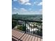 Enjoy city views from this balcony, showcasing a community pool and lush trees at 3481 Lakeside Ne Dr # 2303, Atlanta, GA 30326