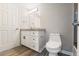 Bright bathroom with grey walls, single sink vanity and shower with glass door at 3481 Lakeside Ne Dr # 2303, Atlanta, GA 30326