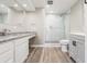 Bathroom featuring white cabinets, granite counters, and glass-enclosed shower at 3481 Lakeside Ne Dr # 2303, Atlanta, GA 30326