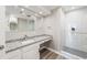 Bright bathroom featuring granite counters, white cabinets and a walk-in shower with glass door at 3481 Lakeside Ne Dr # 2303, Atlanta, GA 30326