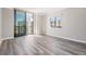 Bright bedroom features modern flooring, neutral tones, and large windows leading to a balcony, creating a comfortable retreat at 3481 Lakeside Ne Dr # 2303, Atlanta, GA 30326