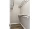 Walk in closet with built in storage and wood laminate flooring at 3481 Lakeside Ne Dr # 2303, Atlanta, GA 30326