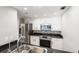 Modern kitchen features stainless steel appliances, granite countertops, and sleek white cabinets, offering style and functionality at 3481 Lakeside Ne Dr # 2303, Atlanta, GA 30326