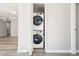 Laundry room features stacked washer and dryer inside closet at 3481 Lakeside Ne Dr # 2303, Atlanta, GA 30326