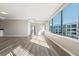 Inviting living room with hardwood floors, neutral paint, large windows and an open layout, creating a serene and airy space at 3481 Lakeside Ne Dr # 2303, Atlanta, GA 30326