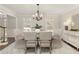 Elegant dining room with hardwood floors, a stylish chandelier, and neutral paint, perfect for entertaining at 3735 Borning Ct, Alpharetta, GA 30022