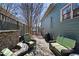Charming outdoor space featuring wicker furniture and a built-in stone fireplace at 1564 Spring Se St, Smyrna, GA 30080