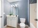 Bathroom with white vanity, tile floor, and shower/tub combination at 1564 Spring Se St, Smyrna, GA 30080
