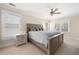 Inviting bedroom with natural light, plush carpet, and a ceiling fan at 1564 Spring Se St, Smyrna, GA 30080