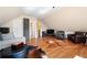 Large bonus room featuring hardwood floors, a comfortable seating area, and an entertainment center at 1564 Spring Se St, Smyrna, GA 30080